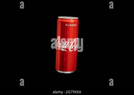 KALININGRAD, RUSSIA - MARCH 13, 2021 - Coca Cola can, black background. Classic coke jar, carbonated soft drink. Manufactured by The Coca-Cola Company Stock Photo