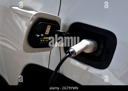 Marseille, France. 10th July, 2021. A close-up of an electric car recharging its batteries in 'rue de la loge' Marseille. (Photo by Gerard Bottino/SOPA Images/Sipa USA) Credit: Sipa USA/Alamy Live News Stock Photo