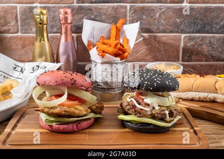 Sheffield, UK : 9 Oct 2017 : American diner food - artisan burgers, hotdog & onion rings at Wagon 1871, Leadmill Road Stock Photo