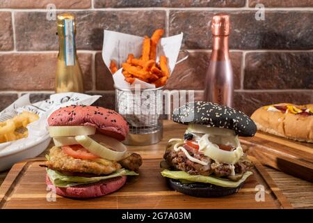 Sheffield, UK : 9 Oct 2017 : American diner food - artisan burgers, hotdog & onion rings at Wagon 1871, Leadmill Road Stock Photo