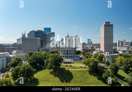 Nashville, Tennessee - 28 June 2021: Aerial drone view of the Tennessee state capitol building in Nashville with the business district Stock Photo