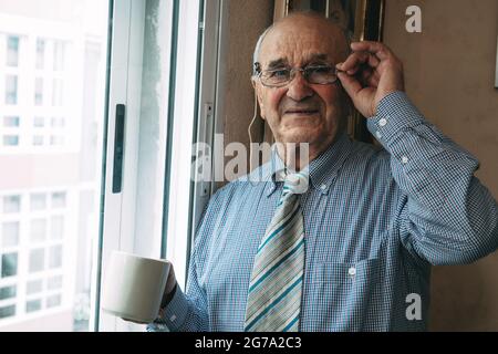 senior man with cup of coffee at home Stock Photo