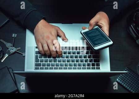 Close up of programmer of hacker hands typing a code Stock Photo