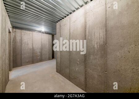 Unfinished empty cold storage room in a basement of a house Stock Photo
