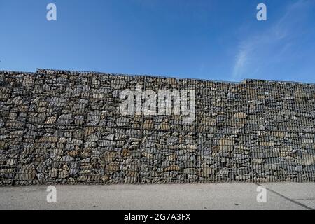 Germany, Bavaria, property line, gabion wall with rubble stones Stock Photo