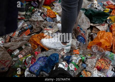 Litter is strewn all over the ground as England fans congregate on Leicester Square ahead of the Euro 2020 Final England vs. Italy. Stock Photo