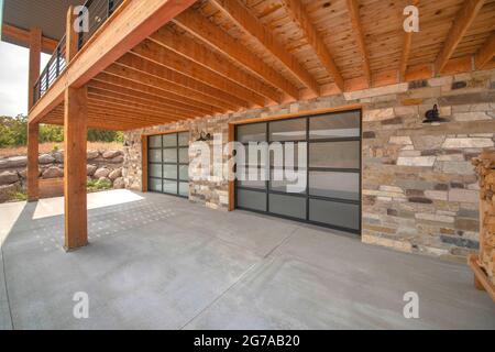 Empty exterior of a house made of wooden pillars and bricked walls. Stock Photo