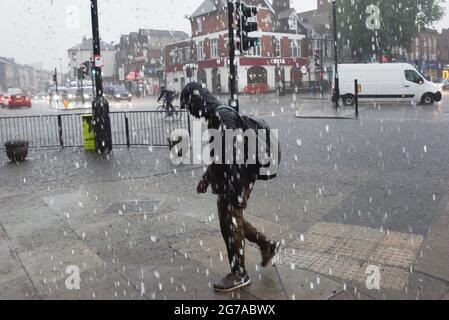 Turnpike Lane, London, UK. 12th July 2021. UK Weather: torrential rain in north London. Credit: Matthew Chattle/Alamy Live News Stock Photo