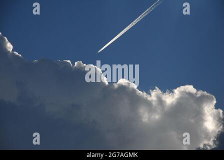 Storm clouds,  clouds, blue sky, airplane trace, white airplane trace, Stock Photo