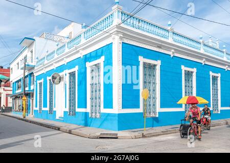City life by the bar restaurant Salon 1720 in Holguin, Cuba, 2016 Stock Photo