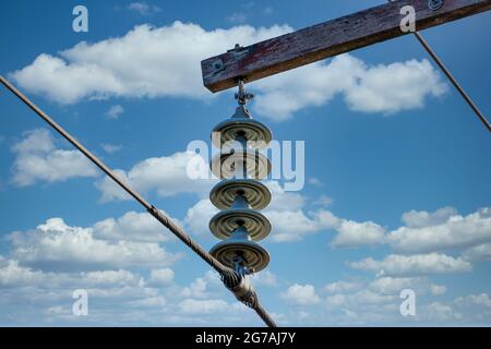 Photograph of a transmission line cable system connected to an assembly bracket Stock Photo