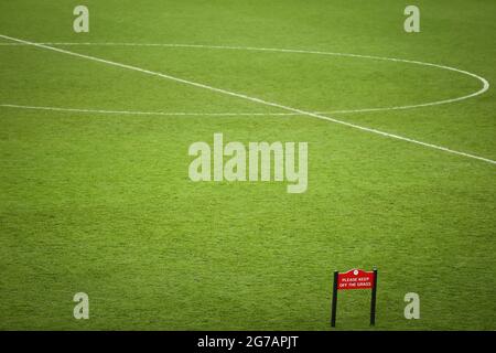 London, UK. 12th July, 2021. Football: European Championship, Italy - England, final round, final at Wembley Stadium. Please keep off the grass' is written on a sign at the edge of the pitch after the match. Credit: Christian Charisius/dpa/Alamy Live News Stock Photo