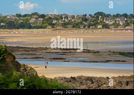 View across expansive sandy beach in Locquirec at low tide, Brittany, France Stock Photo