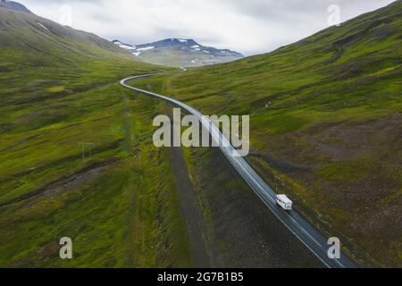 Lonely rent van transporter car drive on remote road with beautiful scenery of Iceland. Stock Photo