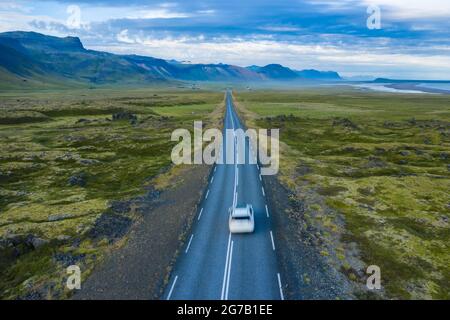 Lonely rent car drive on remote road with beautiful scenery of Snaefellsnes region of Iceland. Stock Photo