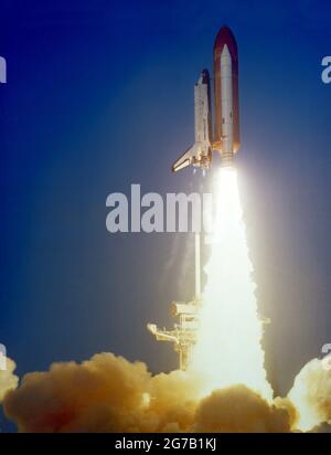 View of the launch of the Shuttle Challenger during the STS 41-C mission. The orbiter has cleared the launch pad with a large cloud of smoke covering the bottom part of the frame. April 6, 1984  A unique optimised and enhanced version of an NASA image / mandatory credit: NASA Stock Photo