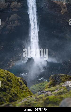 Close up of Haifoss waterfall in South Iceland. Water is crashing against the rocks on the bottom and splashing around. Defocused foreground Stock Photo