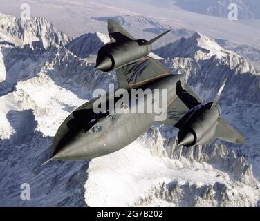 SR-71 Backbird aircraft were used by NASA as testbeds for high-speed, high-altitude aeronautical research. The aircraft here, an SR-71B pilot trainer aircraft were based at NASA's Dryden (now Armstrong) Flight Research Center, Edwards, California. Here the aircraft soars above the snowy southern Sierra Nevada Mountains of California, photographed from a refuelling aircraft.  An optimised and digitally enhanced version of an NASA image / credit NASA Stock Photo