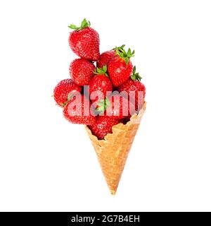 Ice cream cone filled with ripe strawberries isolated on white background. Waffle cone with ripe strawberries. Stock Photo