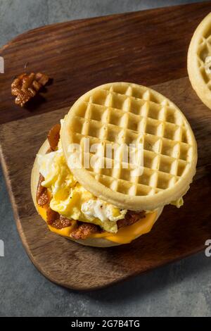 Homemade Healthy Waffle Breakfast Egg Sandwich wtih Bacon and Cheese Stock Photo