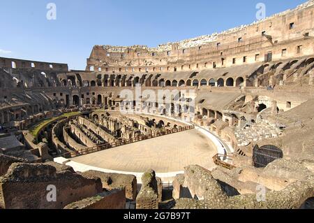 Grandstands and partially restored arena, stage in interior of Colosseum, Rome, Lazio, Italy Stock Photo