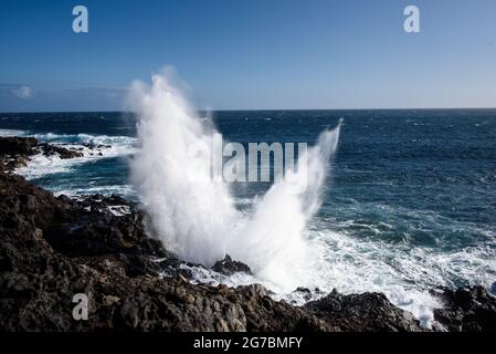 The souffleur at Etang Salé on La Reunion island where waves blow out of the rocks Stock Photo