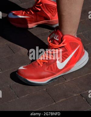 A wears a pair of red Prime DF tennis or athletic shoes in Santa Fe, New Mexico Stock Photo - Alamy