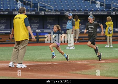 St. Petersburg, FL. USA;  Fans young and old were invited to run the bases after the game for the first time since the 2019 season after a major leagu Stock Photo