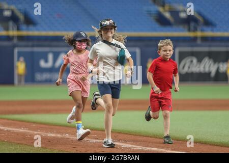 St. Petersburg, FL. USA;  Fans young and old were invited to run the bases after the game for the first time since the 2019 season after a major leagu Stock Photo