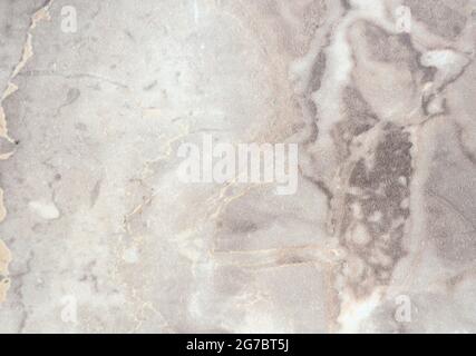 Light gray marble with dark veins and inclusions. Background, pattern, texture. Stock Photo