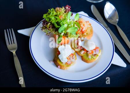 hors d'oeuvres served in a white dish at dinner Stock Photo