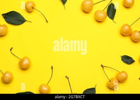 Frame made of tasty sweet cherries on color background Stock Photo