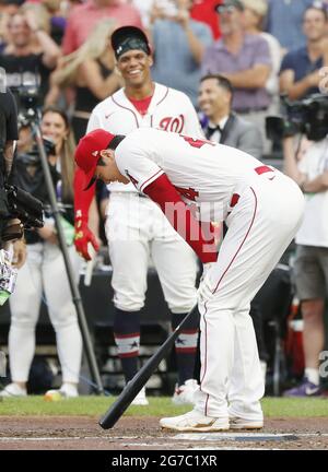 Washington Nationals' Juan Soto, front, stands in the dugout before a  baseball game against the Kansas City Royals, Saturday, July 6, 2019, in  Washington. The Nationals are paying tribute to the Montreal