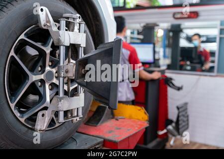 Balancing center wheel of car Stock Photo - Alamy