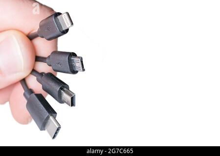 Four types of charging cables in front of white background with copy space Stock Photo