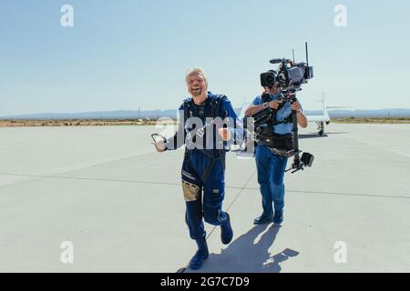 Handout photo of Sir Richard Branson Running to hug family after landing from space Unity 22. Sir Richard Bronson made history with his successful flight from Spaceport America to the edge of space aboard his own passenger rocket ship. The Virgin Galactic space plane Unity landed safely in New Mexico on Sunday morning July 11, 2021. Photo by Virgin Galactic via ABACAPRESS.COM Stock Photo