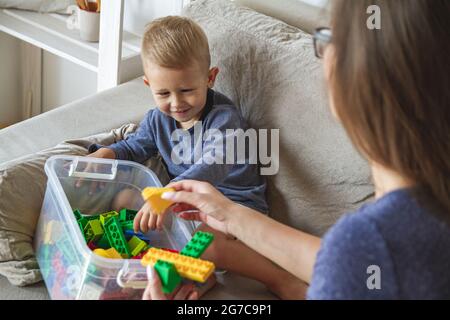 Mom and son play building block toys Stock Photo