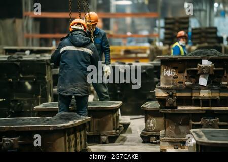 Construction of the building. Workers unrecognizable make metal ...