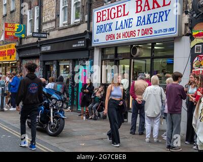 London- July, 2021:  Beigel Bake, a famous bagel shop on Brick Lane, a fashionable area of East London Stock Photo
