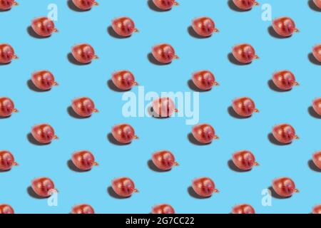 Repeated Ripe Onion on blue background.  Italian Onion Ramata di Milano. Seamless pattern Stock Photo