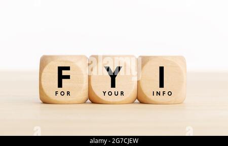 FYI or for your information text on wooden blocks. Copy space Stock Photo