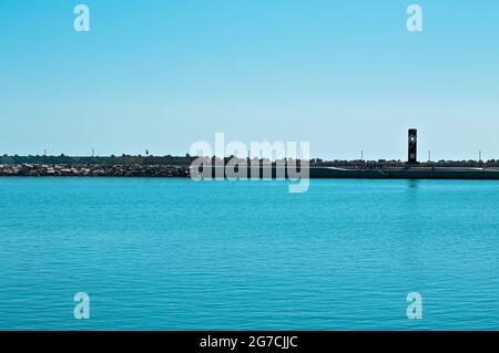 Pesaro, Italy - 09 july 2020: The eastern pier of the port of Pesaro Stock Photo