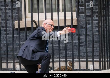 London, UK. 13th July, 2021. a New Zealand delegation arrives at 10 Downing Street London UK Chris Seed, Chief Executive and Secretary of Foreign Affairs and Trade for New Zealand takes a selfie with Larry the Downing Street cat Credit: Ian Davidson/Alamy Live News Stock Photo