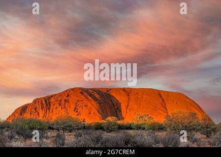Uluru, Australia - July 10, 2021 - Uluru, the famous gigantic monolith rock in the Australian desert. Image taken from the approved public viewing and Stock Photo