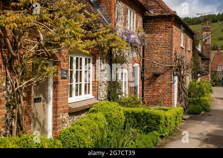 UK, England, Buckinghamshire, Hambleden Valley, Turville, School Lane, Wisteria in flower outside Belle Cottage Stock Photo