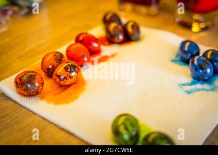Freshly painted colorful easter quail eggs lie in the kitchen Stock Photo