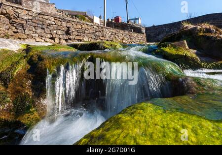 Close up view of a small waterfall at Gayle Beck near Hawes in the Yorkshire Dales Stock Photo