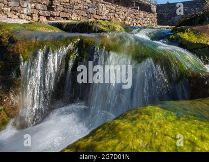 Close up view of a small waterfall at Gayle Beck near Hawes in the Yorkshire Dales Stock Photo