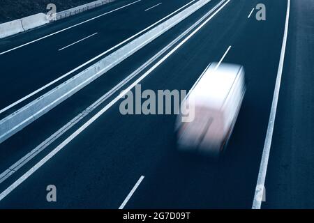 Fast moving blurry cars driving on the highway. European highway traffic at blurry motion. Motorway traffic in the Czech Republic. Stock Photo