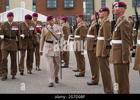 The Prince of Wales, Colonel on Chief, inspects the front rank of representatives from 1st, 2nd and 3rd Battalions of the Parachute Regiment during a ceremony to present new colours to the Regiment at Merville Barracks in Colchester. Picture date: Tuesday July 13, 2021. Stock Photo